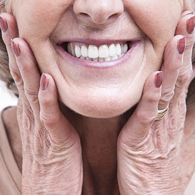 Old Woman Smiling — Dental Services in East Maitland NSW